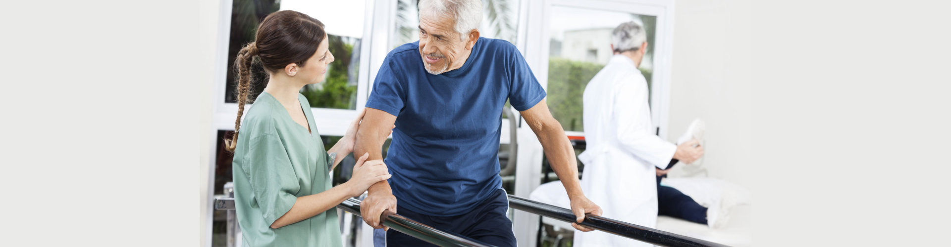 Patient Looking At Female Physiotherapist